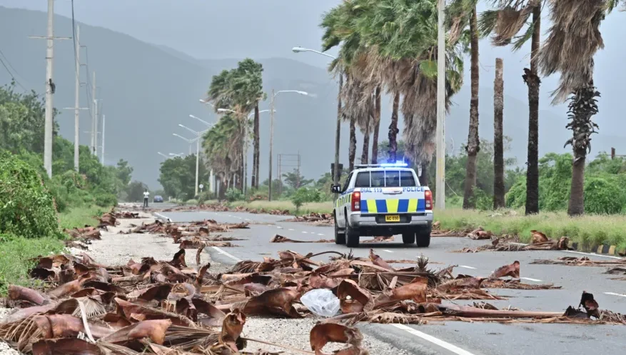 Jamaicans start to reveal devastation as hurricane causes floods, power cuts and splits city in two